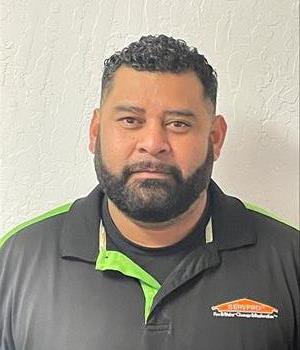 SERVPRO employee in front of white background